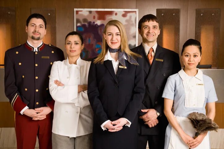 Поиск отеля по фото Portrait of serious hotel staff Boston Hospitality Review