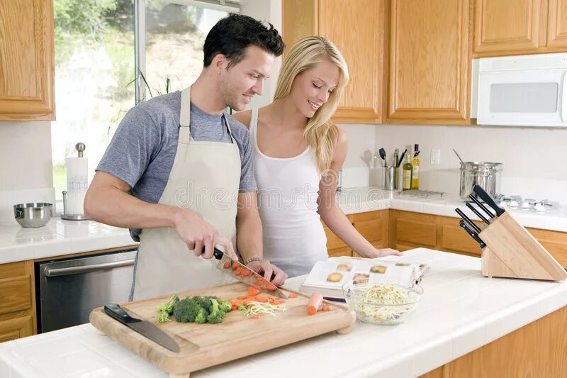 Пока муж на работе фото Couple cooking in kitchen stock image. Image of boyfriend - 54452901