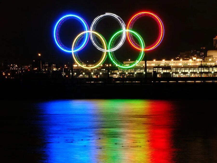 Покажи фото олимпийских колец What Do the Olympic Rings and Flame Represent? Britannica