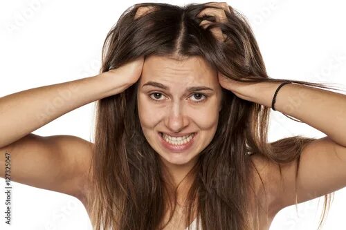 Покажи как выглядят волосы nervous young woman scratching her scalp. фотография Stock Adobe Stock