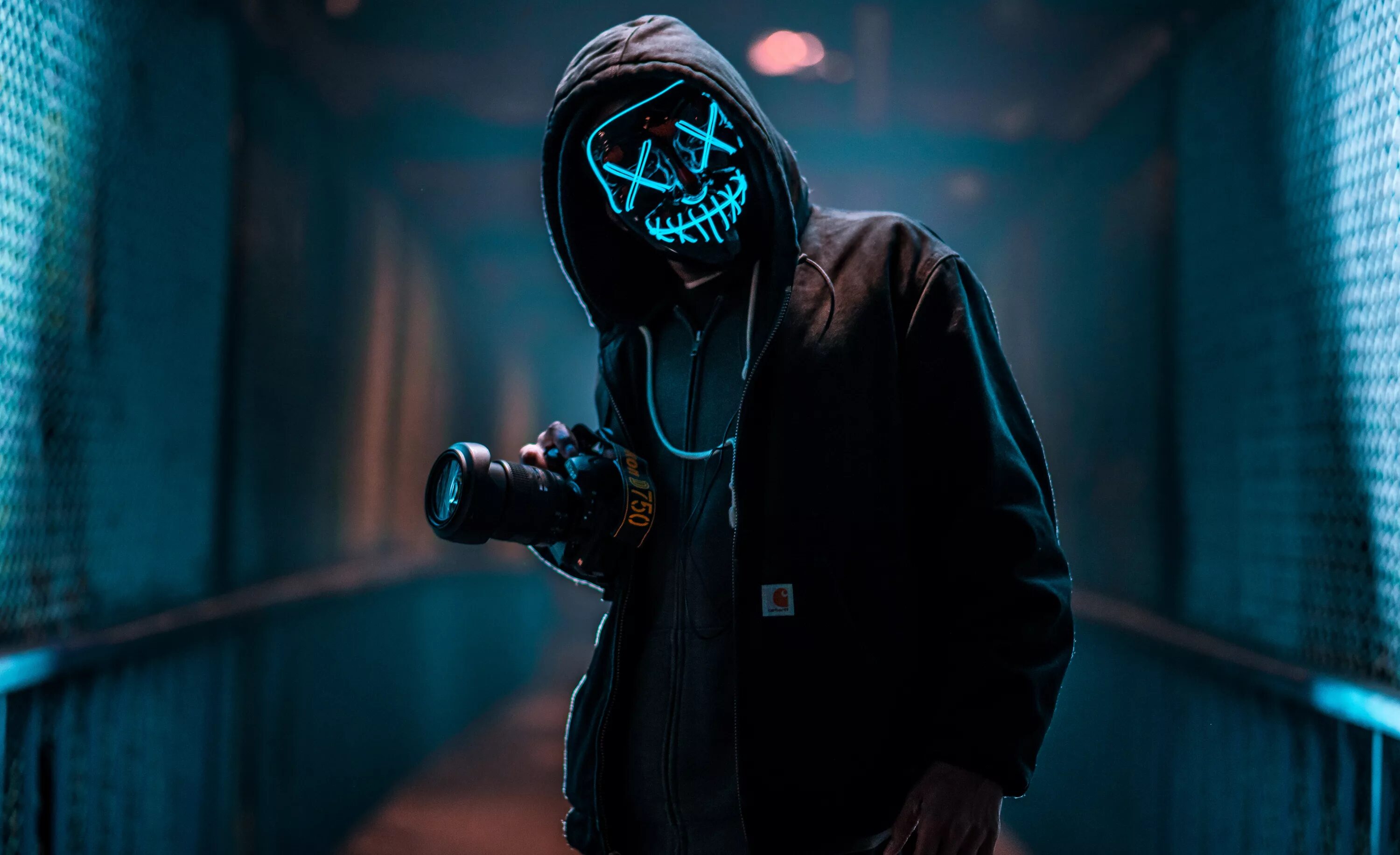 Покажи крутые фото A guy in an anonymous neon mask with a camera Desktop wallpapers 600x1024