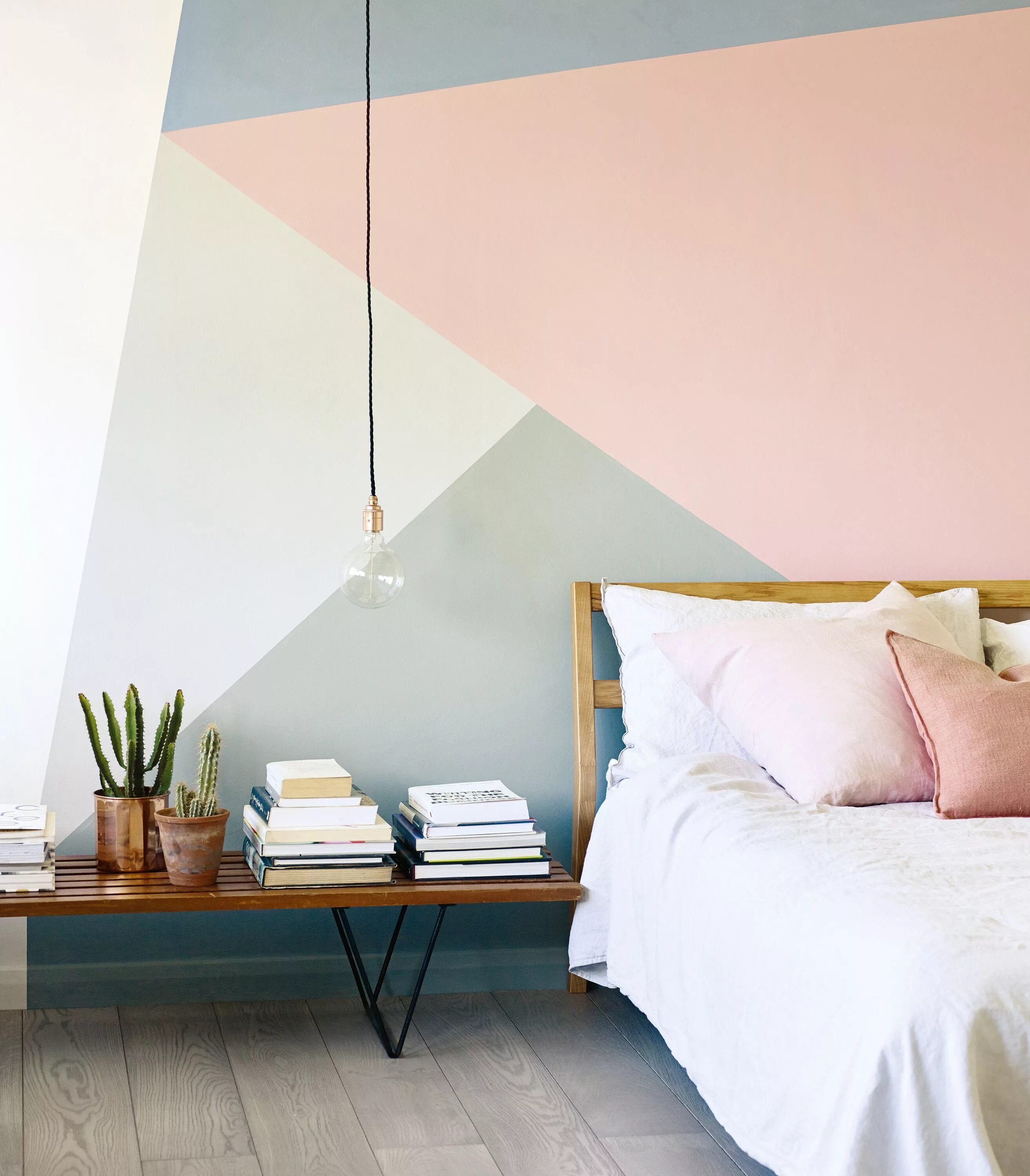 Покраска стен современный дизайн фото geometric wall pattern in pink, grey, blue and white by Fired Earth in a bedroom