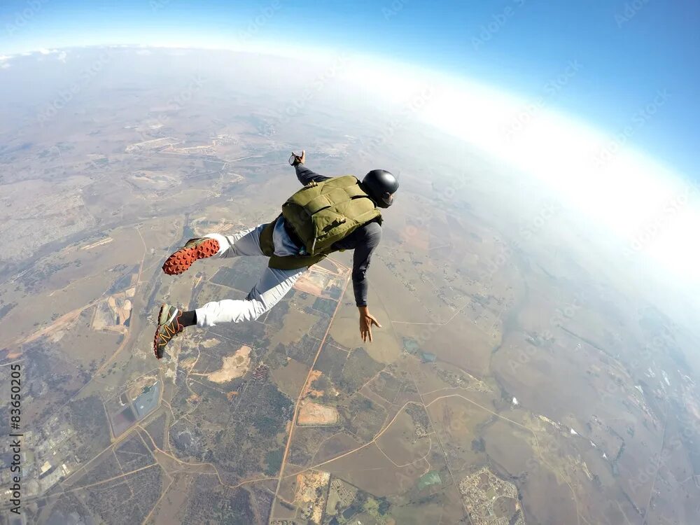 Полет с парашютом фото Skydiver in action Фотографія Stock Adobe Stock