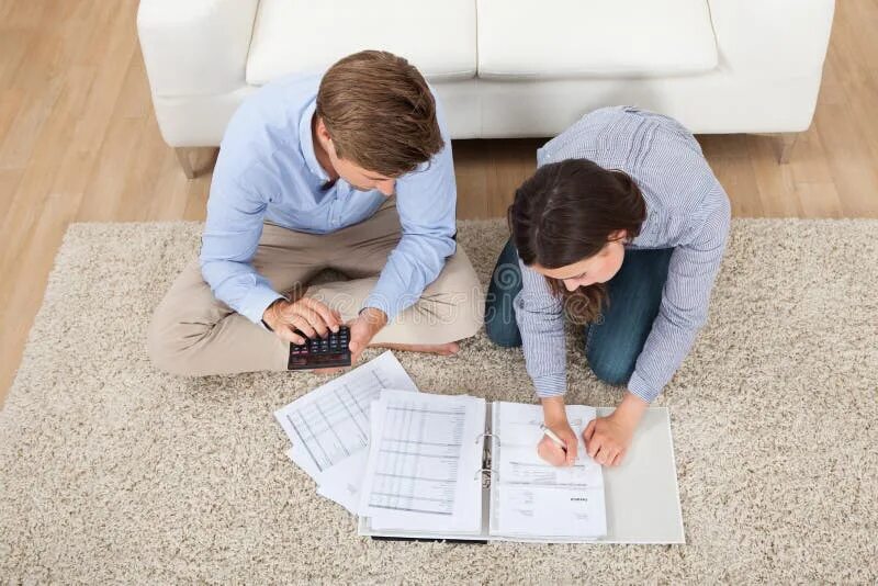 Помощь оформлении квартиры Couple Calculating Budget at Home Stock Photo - Image of formal, plan: 57970908