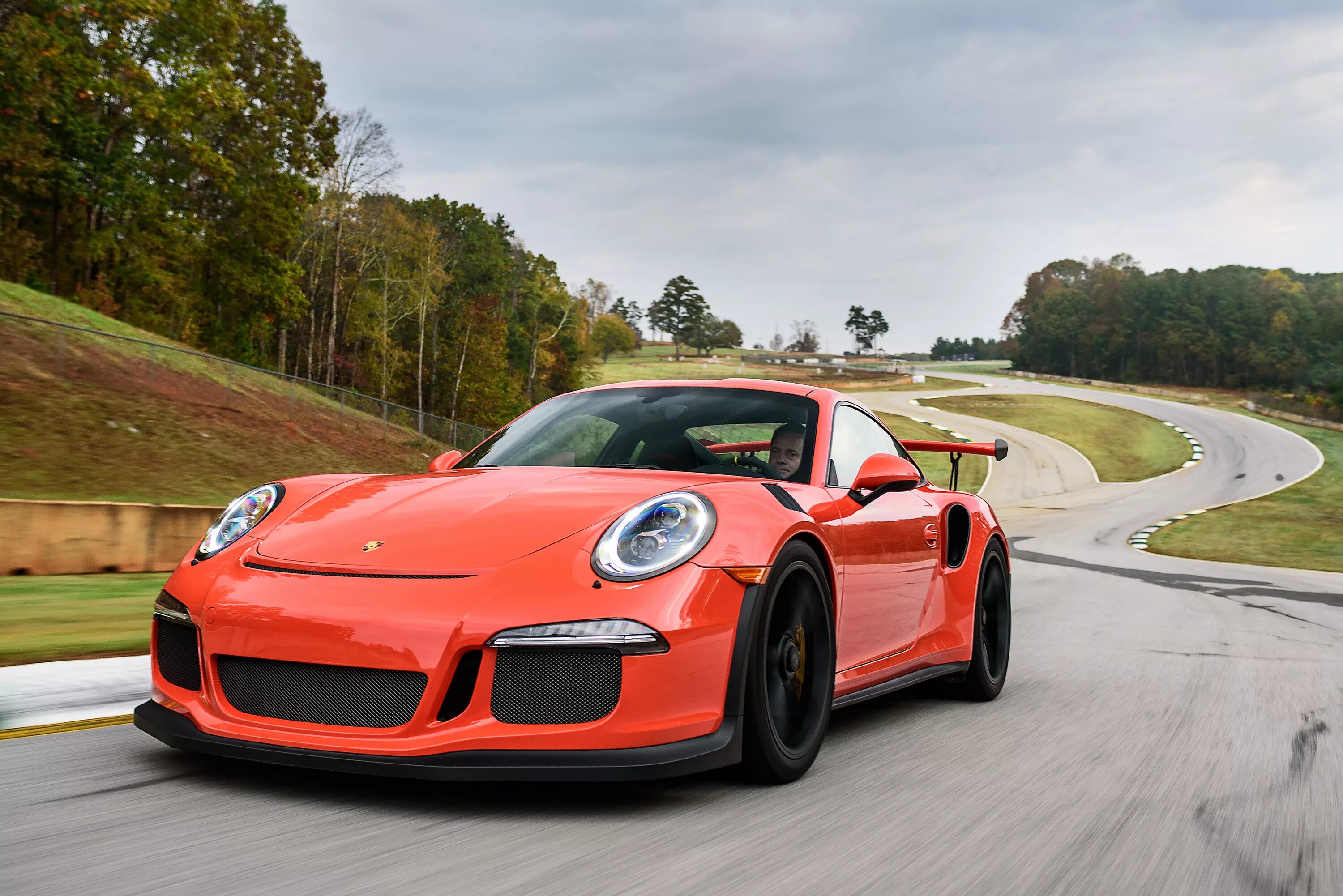 Порше спортивные фото Orange sports car Porsche 911 GT3 on the track Desktop wallpapers 640x960