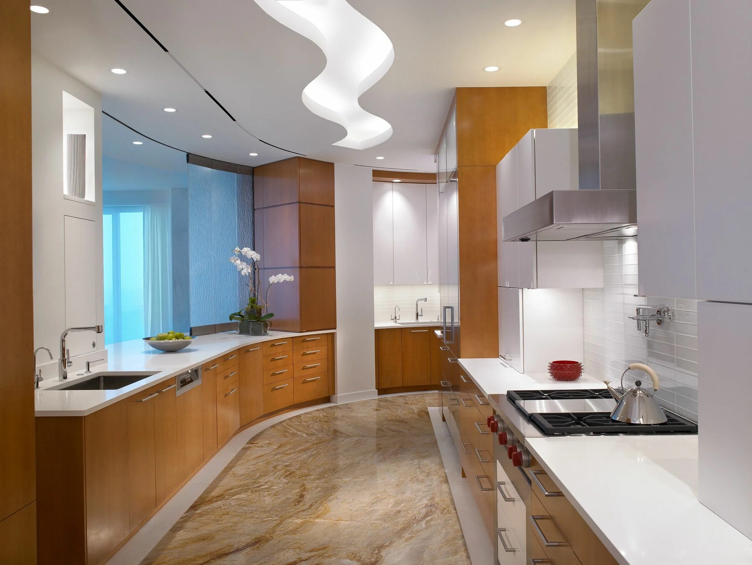 Потолки на кухне варианты дизайна A modern kitchen with quartz counter top and custom S-curved lighted ceiling. De