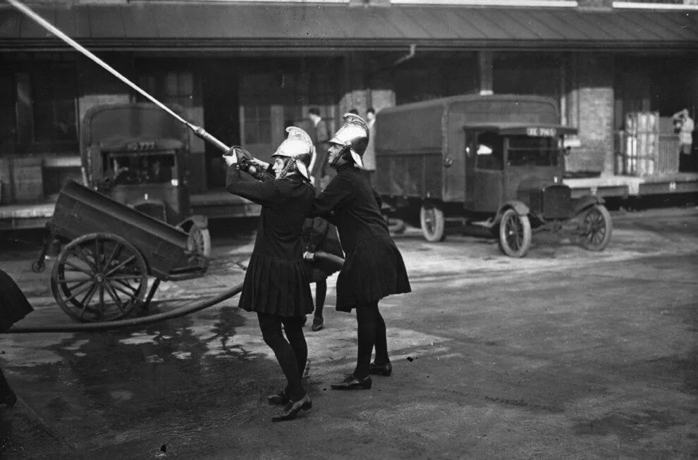 Пожарный 19 века фото 1928, Two firefighters during a drill. Female firefighter, Firefighter, Firefigh