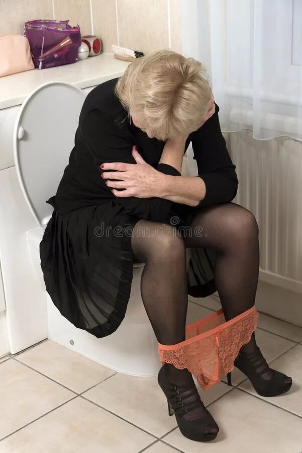 Пожилые бабы ссут в туалете фото Woman with Bowed Head Sitting on Toilet Stock Photo - Image of dress, anguish: 1