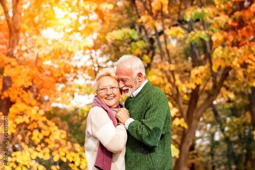 Пожилые люди осенью фото Senior couple enjoying in nature and love - Buy this stock photo and explore sim