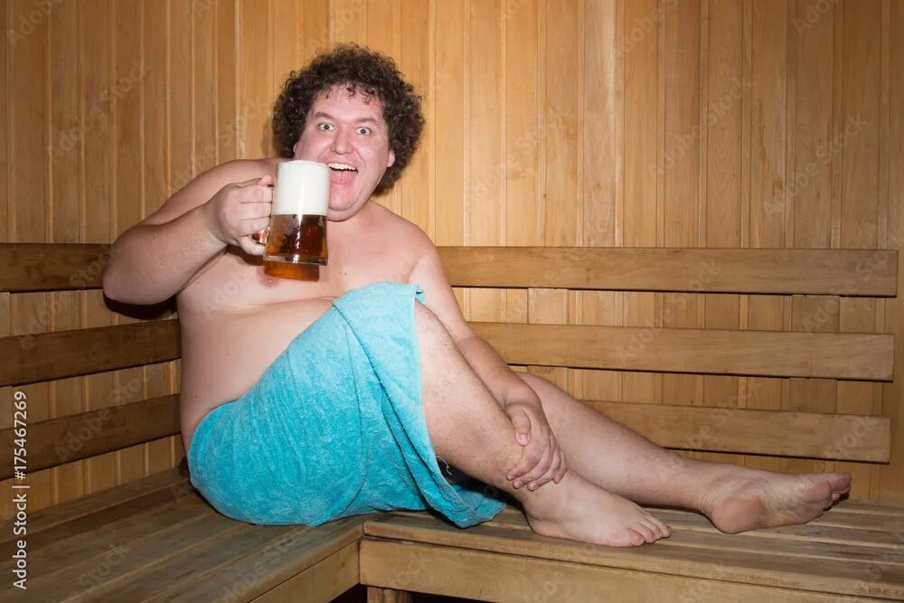 Пожилые в бане фото Funny fat man in a sauna with a beer. фотография Stock Adobe Stock