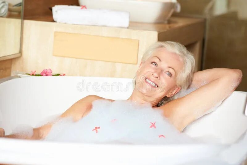 Пожилые в ванной фото Senior Woman Relaxing Bath Drinking Champagne Stock Photos - Free & Royalty-Free