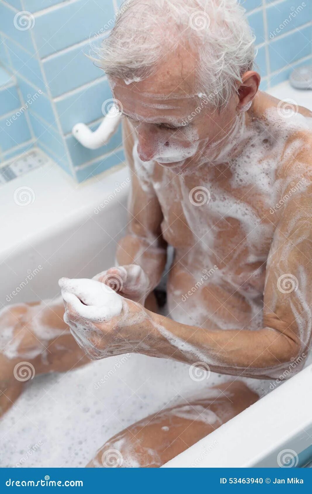 Пожилые в ванной фото Senior man bathing stock photo. Image of senior, shower - 53463940