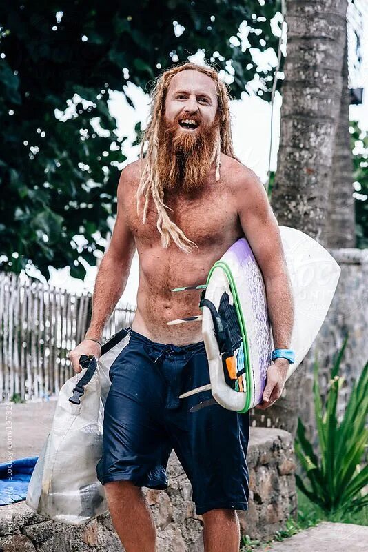 Прическа серфера мужская "Portrait Of Red Bearded Surfer Carrying His Surfboard" by Stocksy Contributor "