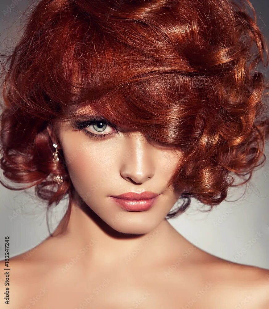 Прически для рыжих волос женские Beautiful model girl with short red curly hair .Red head hairstyle . Care and be