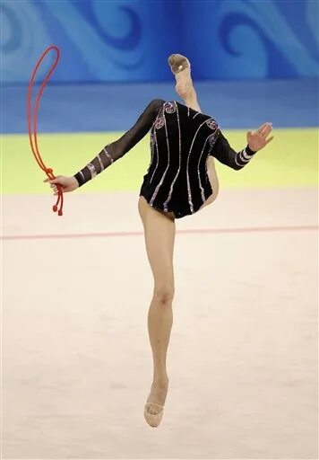 Прически гимнасток 2024 Russia's gymnast Olga Kapranova performs with the rope during the gymnastics rhy