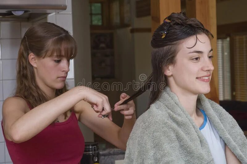 Прически сестра Teenage sister s haircut stock photo. Image of indoor - 6834662