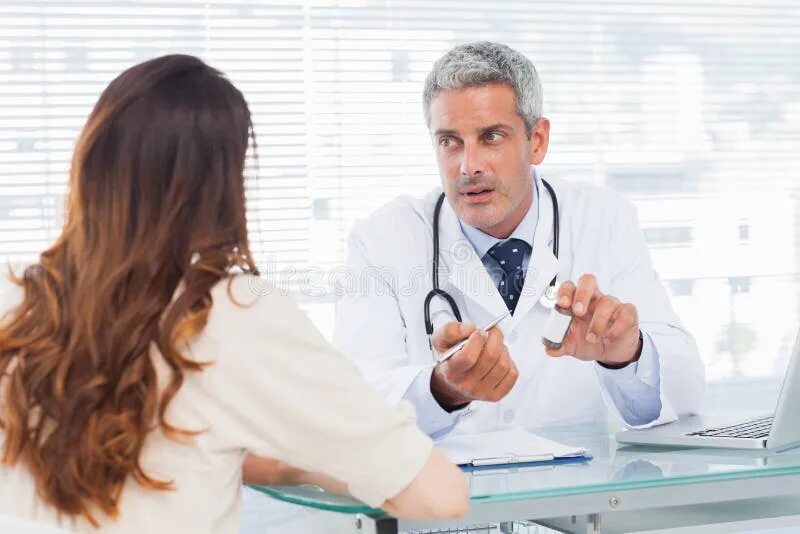 Прием у доктора фото Doctor Talking with His Patient Stock Image - Image of office, adult: 22362655