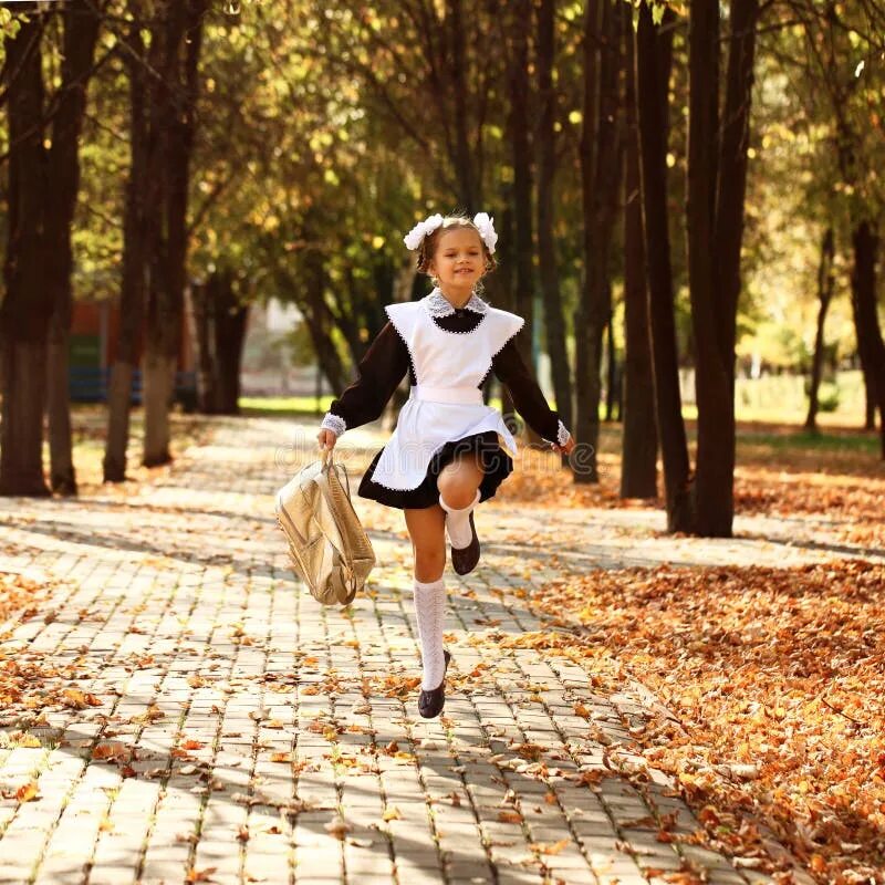 Природа школьницы фото Happy Little Schoolgirl Go Home from School Stock Photo - Image of autumn, child