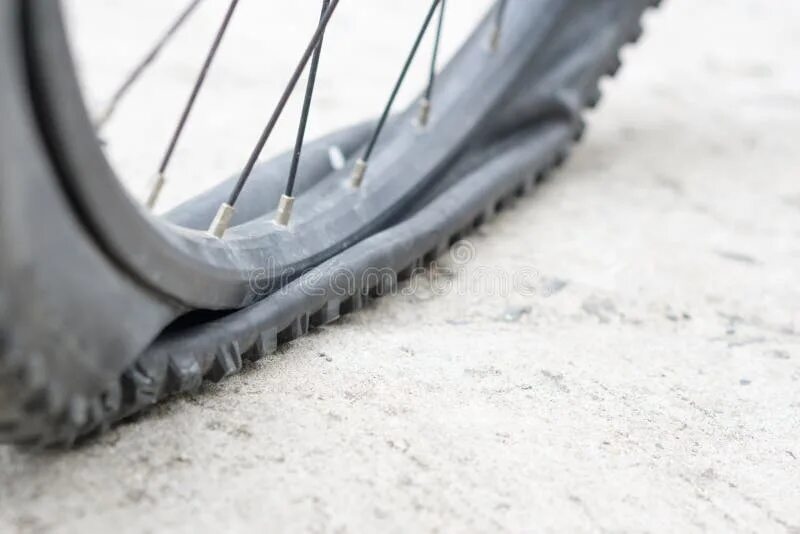 Пробитое колесо велосипеда фото Bicycle Wheel with Flat Tyre on the Concrete Road. Stock Image - Image of bike, 