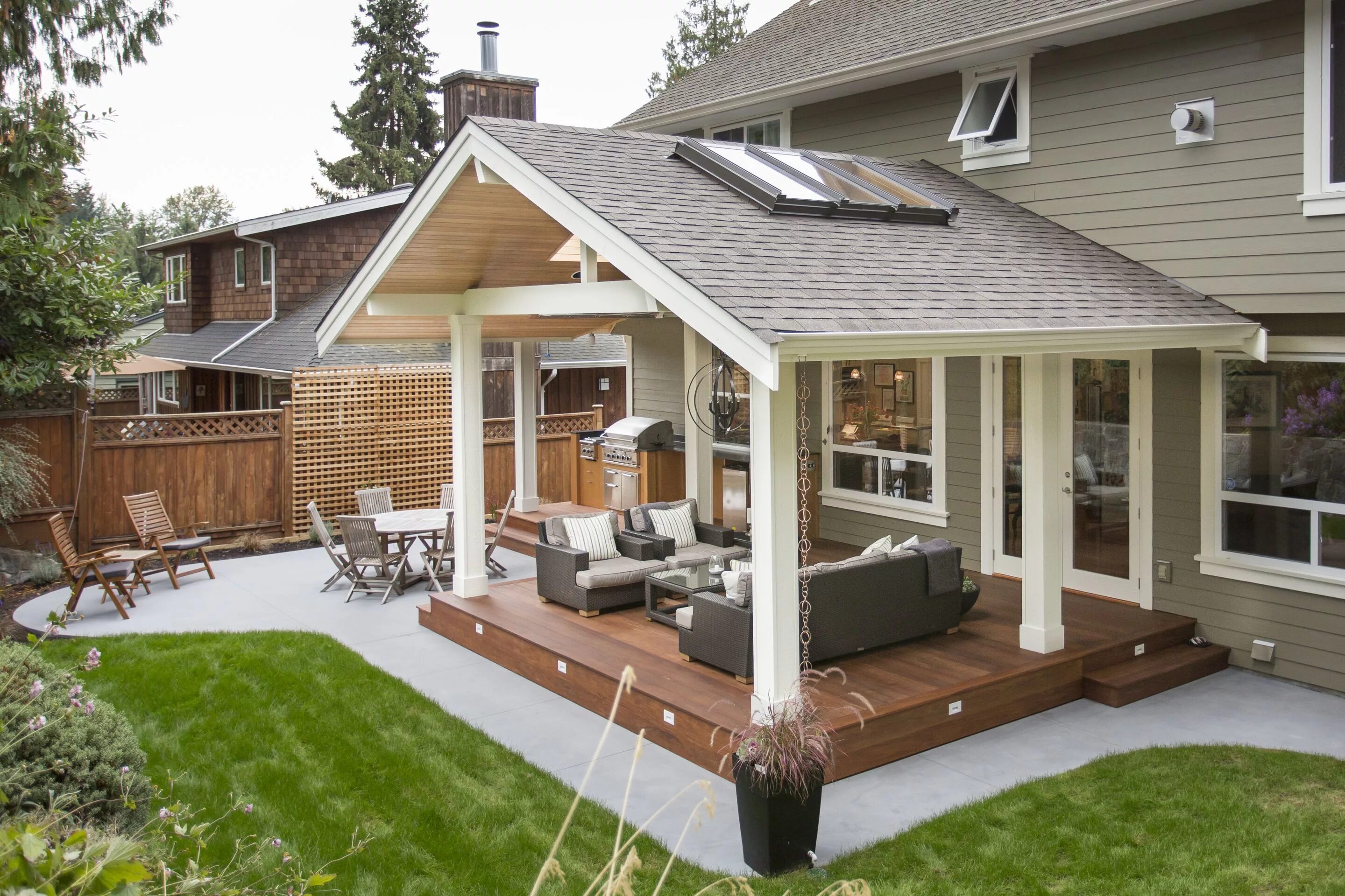 Проекты террас пристроенных к дому фото Outdoor Kitchen in a Transitional Style by Synthesis Design Covered patio design