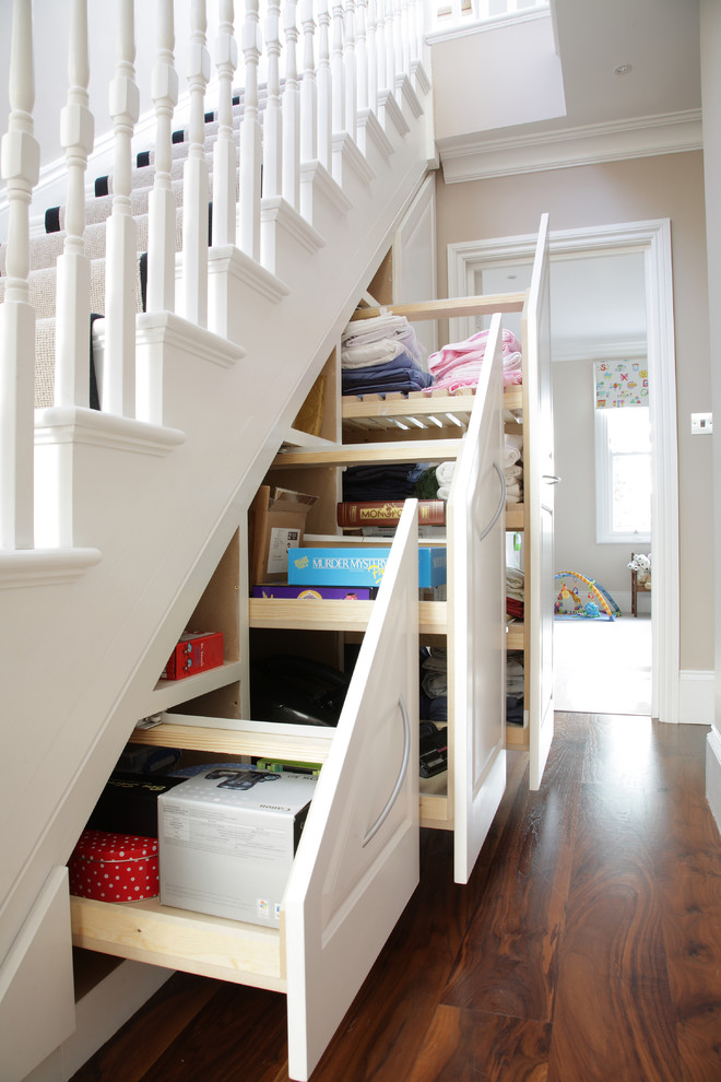 Пространство под лестницей в доме фото Traditional under stairs storage unit in London, UK - Классический - Лестница - 