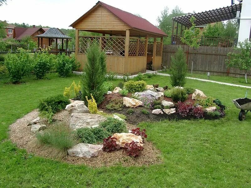 I luv this formal layout of raised garden beds. The chunky red bricks look outst