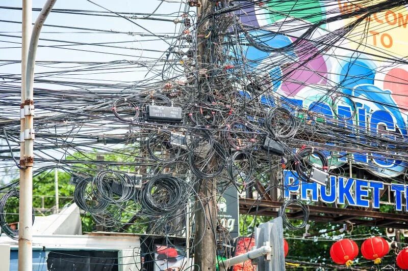 Провода в тайланде на улице фото Lamp Post on Tangle of Electrical Wires Background Editorial Stock Image - Image