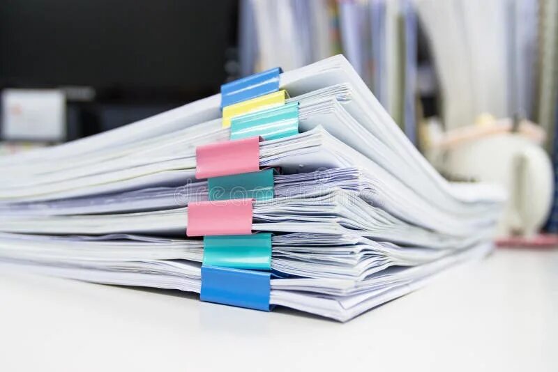 Рабочие бумаги фото File Folder and Stack of Business Report Paper File on the Table Stock Photo - I