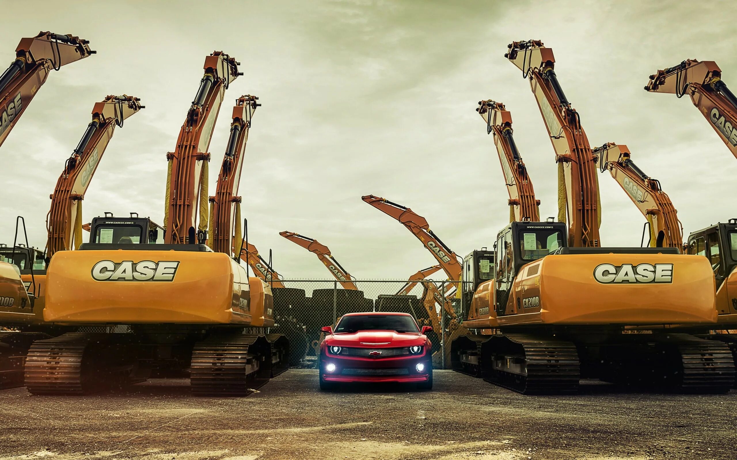 Рабочие машины фото Chevrolet Camaro between excavators Desktop wallpapers 640x960