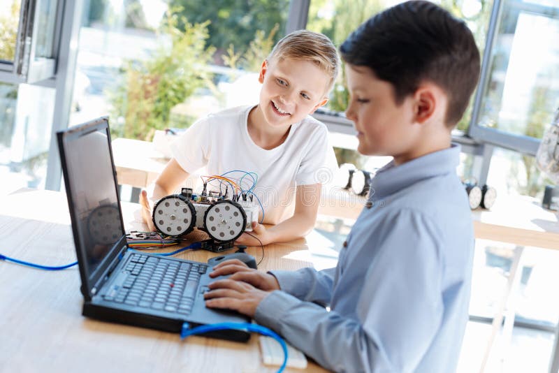 Работа подростков фото Little Boy Using a Laptop during Robotics Workshop Stock Image - Image of appara