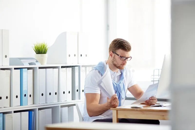 Работа с документами фото Young Man Reading Documents Stock Photo - Image of businessman, professional: 76