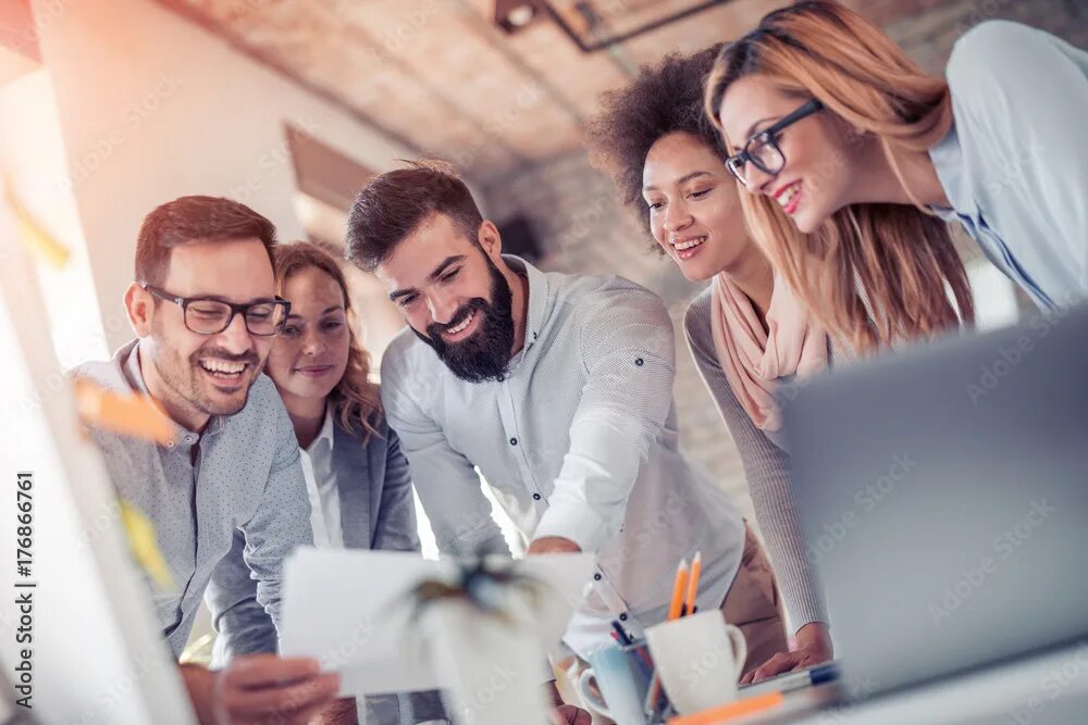 Работа в компании фото Young business people in modern office Фотографія Stock Adobe Stock