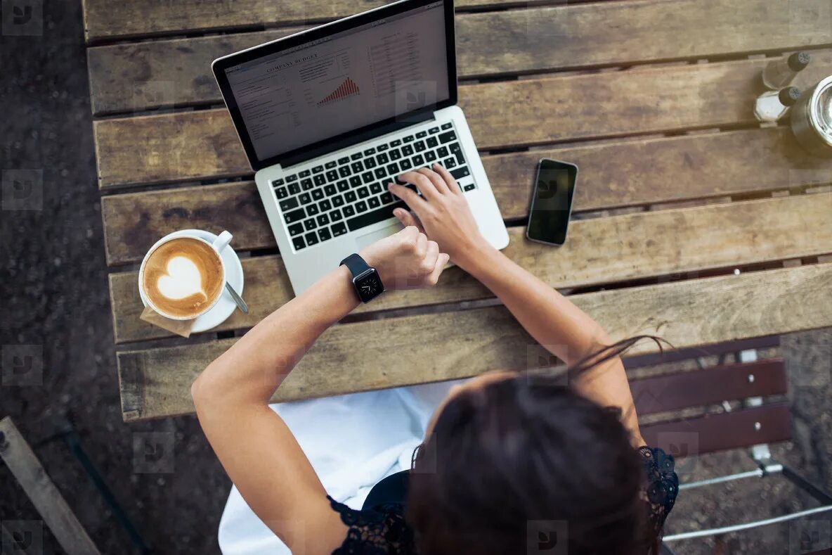 Работа за ноутбуком фото Woman at coffee shop checking time on smartwatch stock photo (121732) - YouWorkF