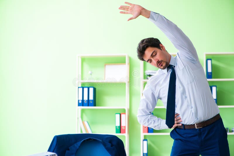 Работник зала картинка Businesswoman Stretching in Chair Tired after Long Work at Lapto Stock Photo - I