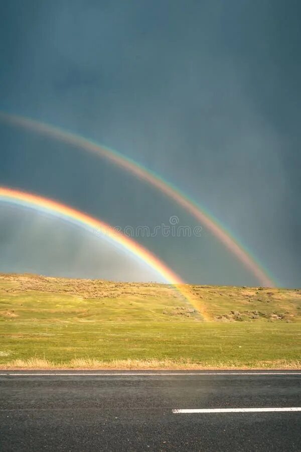 Радуга в небе после дождя фото Rainbow on the Road with Clouds on Sky Stock Photo - Image of ominous, nature: 1