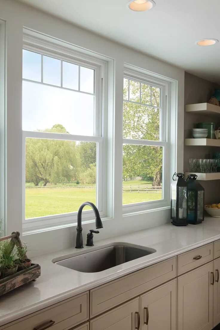 Раковина у окна в доме фото Valence grids give these kitchen sink windows a new sophistication. Featured: Tu