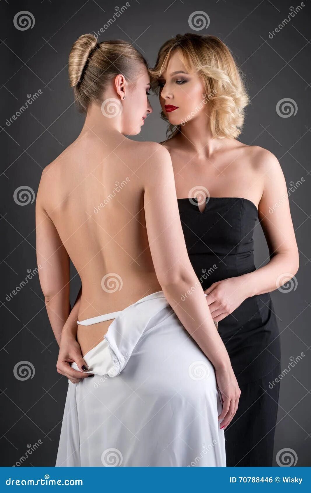 Раздевать одежду девушку фото Elegantly Dressed Woman Undresses Her Girlfriend Stock Photo - Image of nude, na