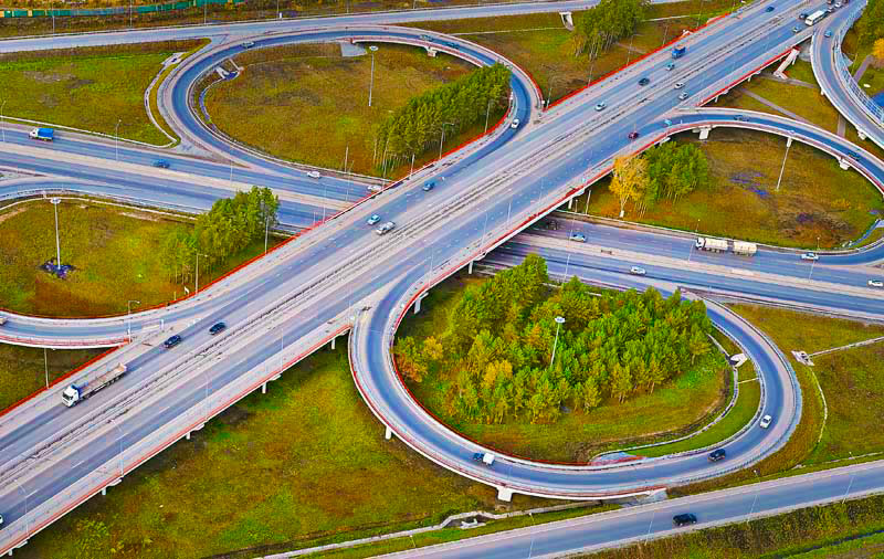 Aerial View of Highway in City. Cars Crossing Interchange Overpass. Highway Inte