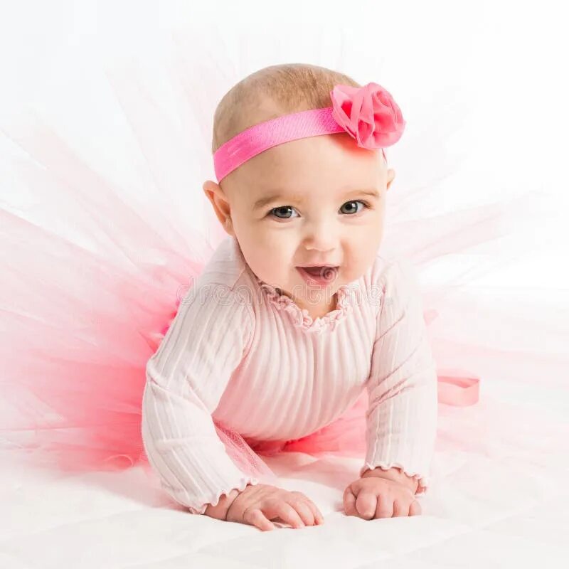 Ребенок в розовом фото Six-month Girl in a Pink Skirt Stock Image - Image of princess, cheerful: 573696