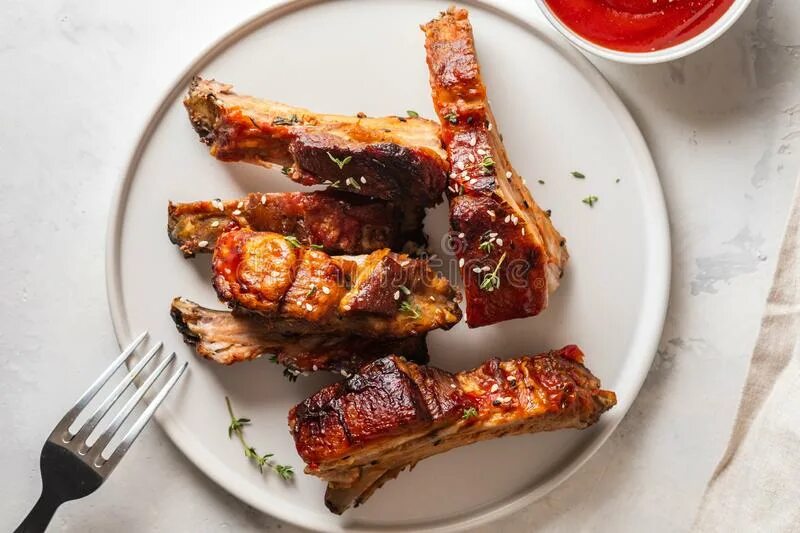 Ребрышки в соусе фото Bbq Pork Ribs with Chili Sauce on White Plate. Pork Ribs on Slate Background. Co