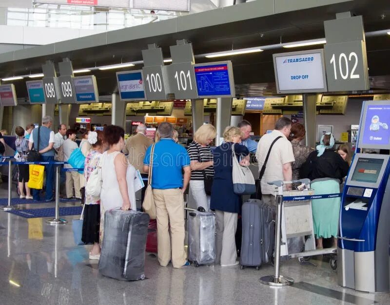 Регистрация в аэропорту фото The Queue of People in the Booking Office Vnukovo Airport, Moscow, Russia Editor