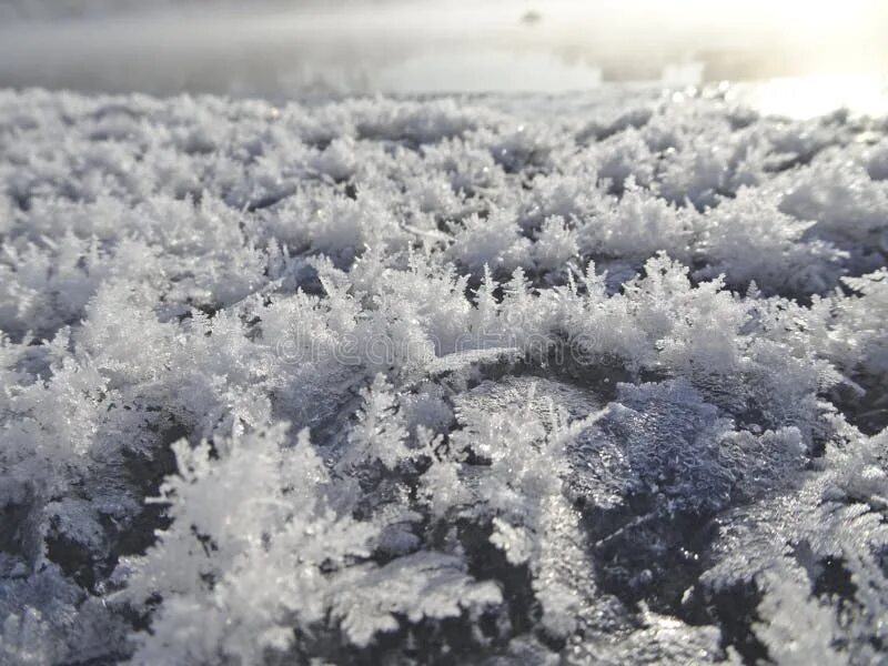 Река снежинка углегорский район фото Crystals of Snowflakes on the Ice Against a Frozen River Stock Photo - Image of 