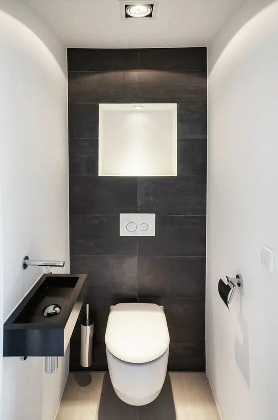 Ремонт маленького туалета фото дизайн a minimalist guest bathroom with black and white tiles of different sizes, a bla